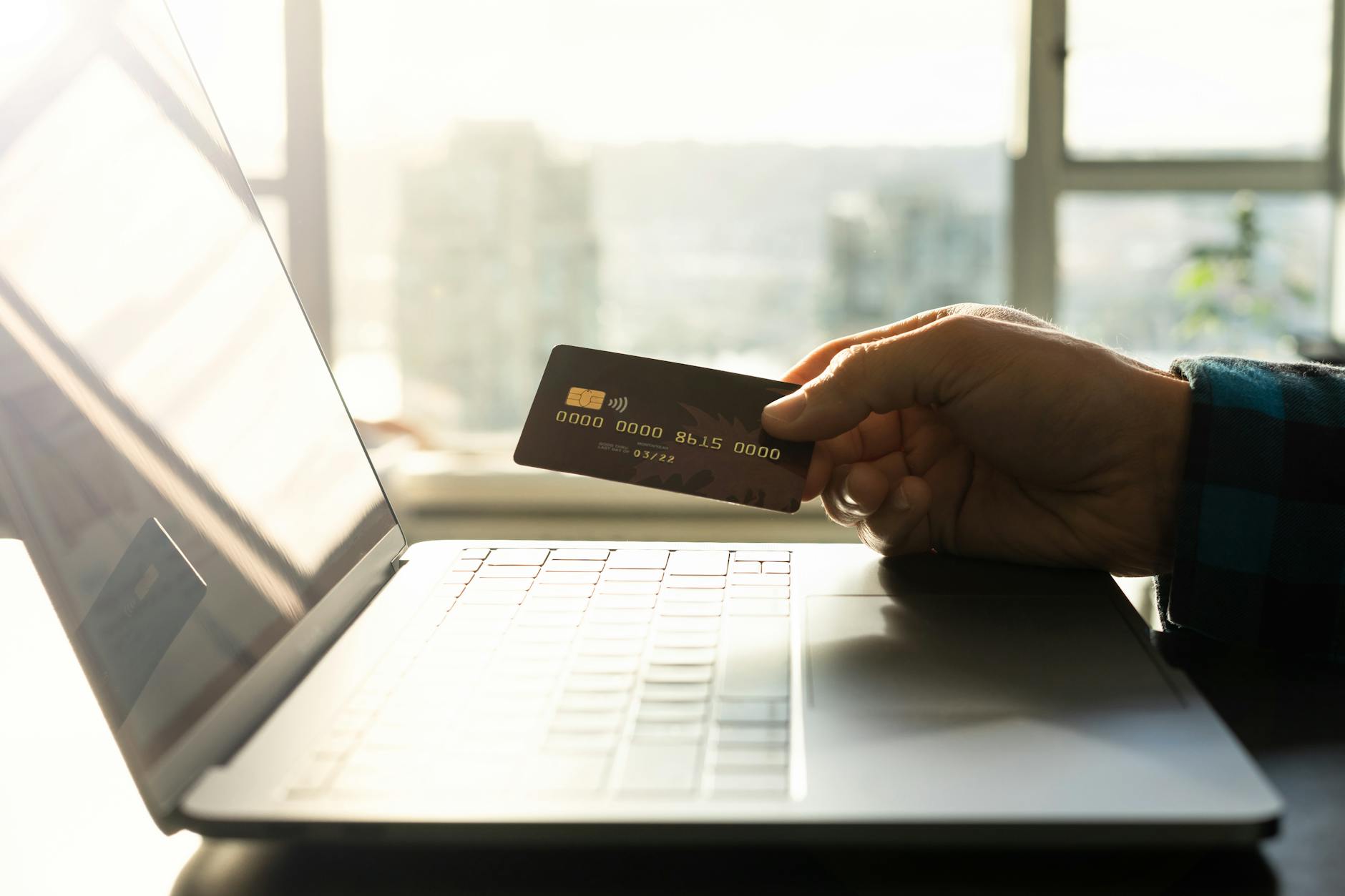 online shopping with credit card and laptop